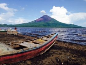 Painting of volcanoe in Nicaragua, with boat in foreground – Best Places In The World To Retire – International Living